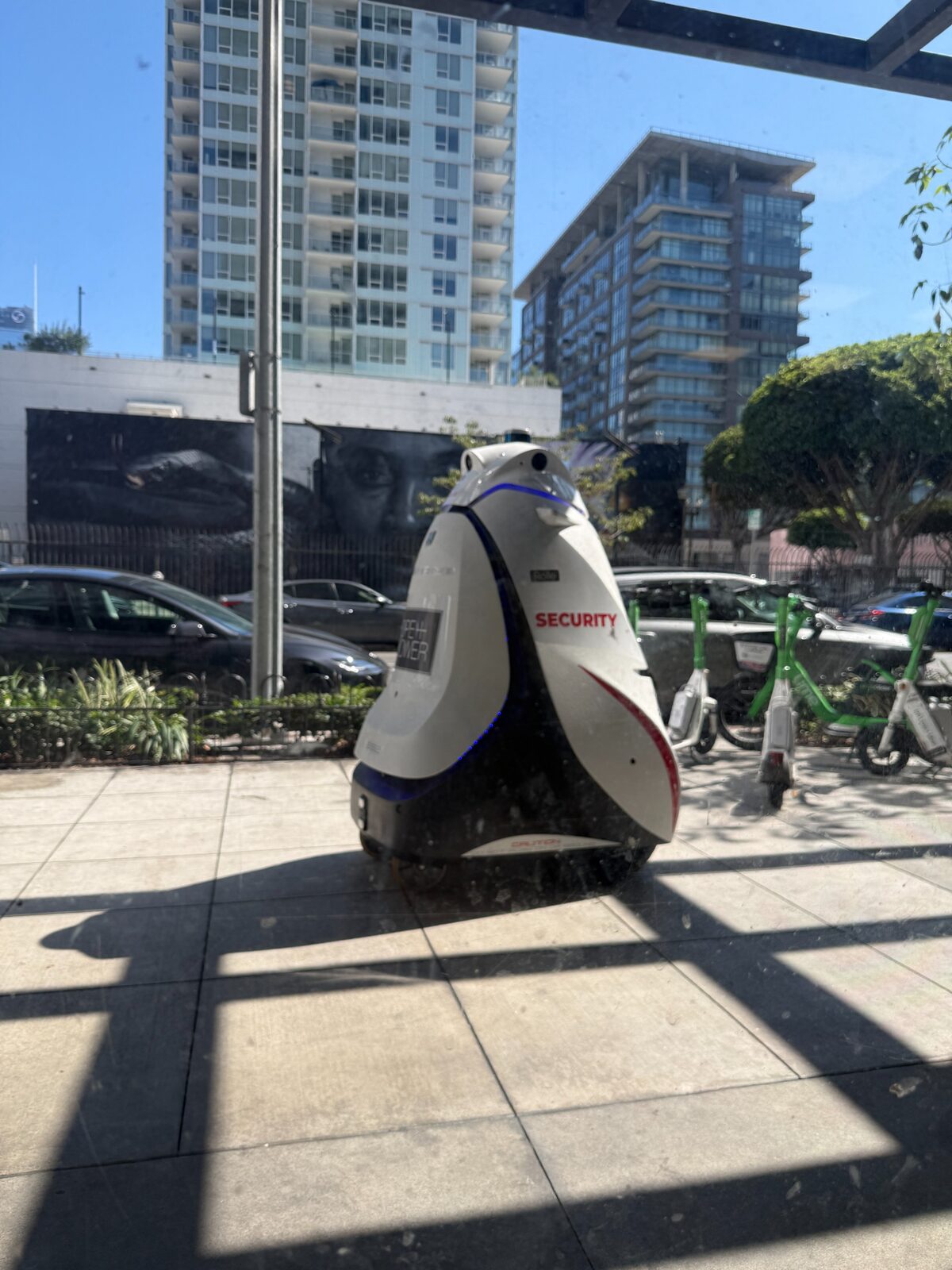 Security robot doing his rounds outside the shop
